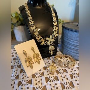 Beautiful costume jewelry gold tone necklace bracelet ring and earrings